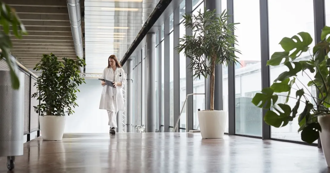 A doctor walking down a hallway