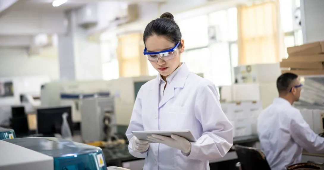 Clinician consults aI-enabled decision support Clinician stands, working with a tablet