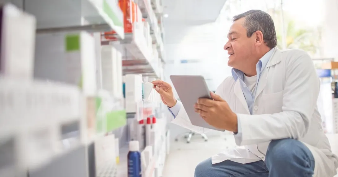 A pharmacist using a digital tablet to do an inventory A pharmacist using a digital tablet to do an inventory