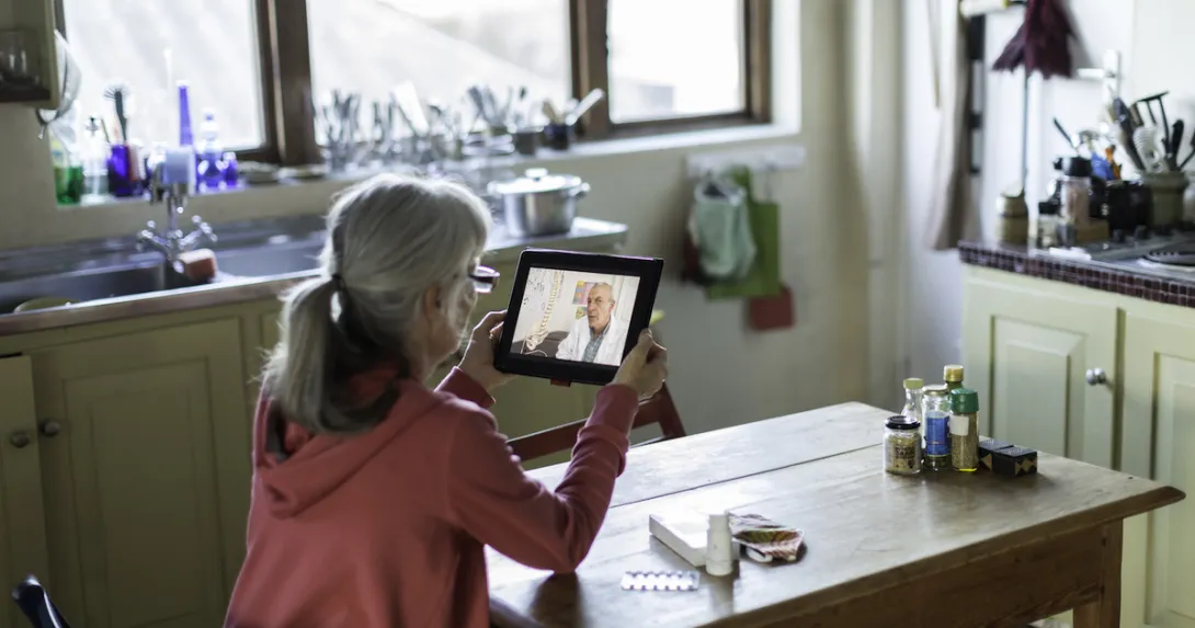 Patient attending telehalth appointment on tablet