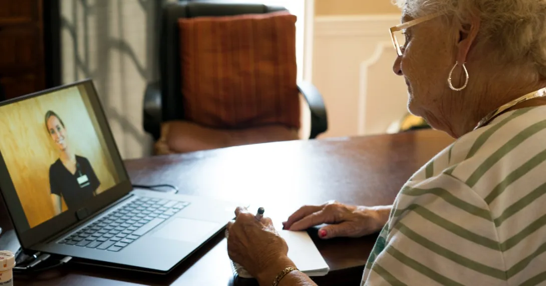 A woman speaking to her doctor via telehealth