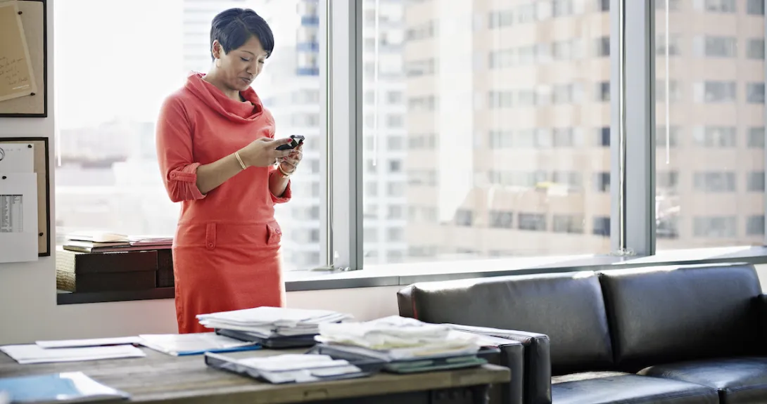 Office worker using smartphone