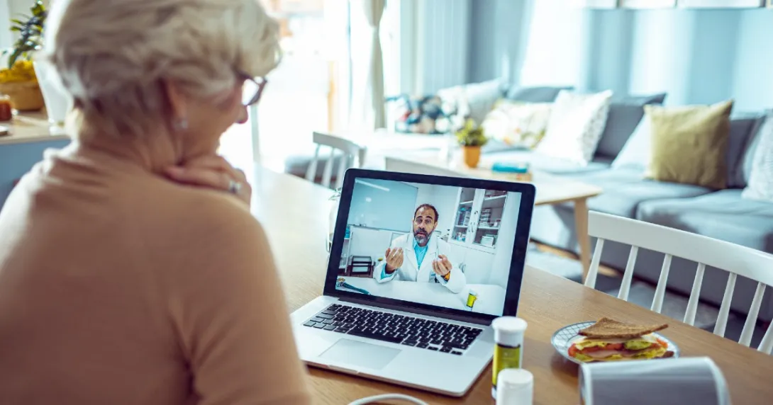 A patient speaks to their doctor on video chat