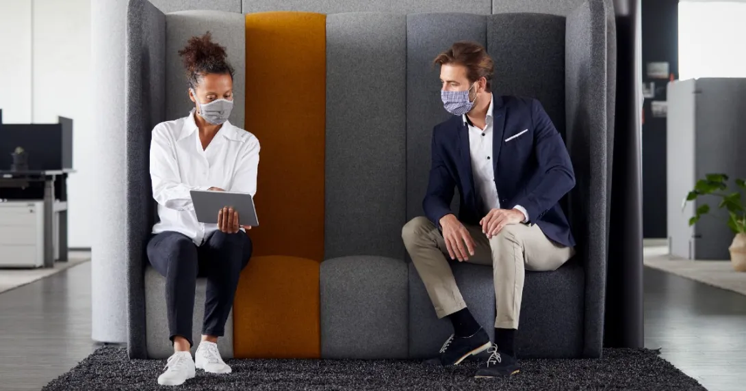 Two employees on a couch together