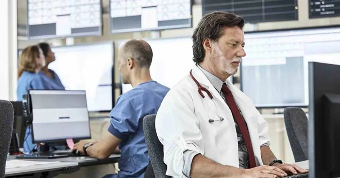 Healthcare workers using computers in an office