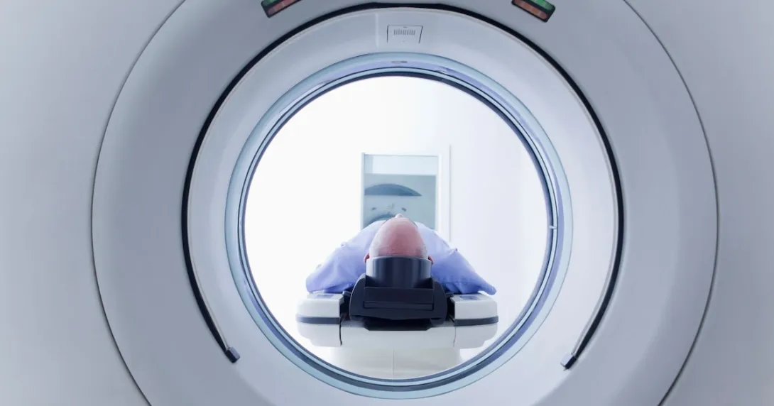 A patient undergoing CT scanning A patient undergoing CT scanning