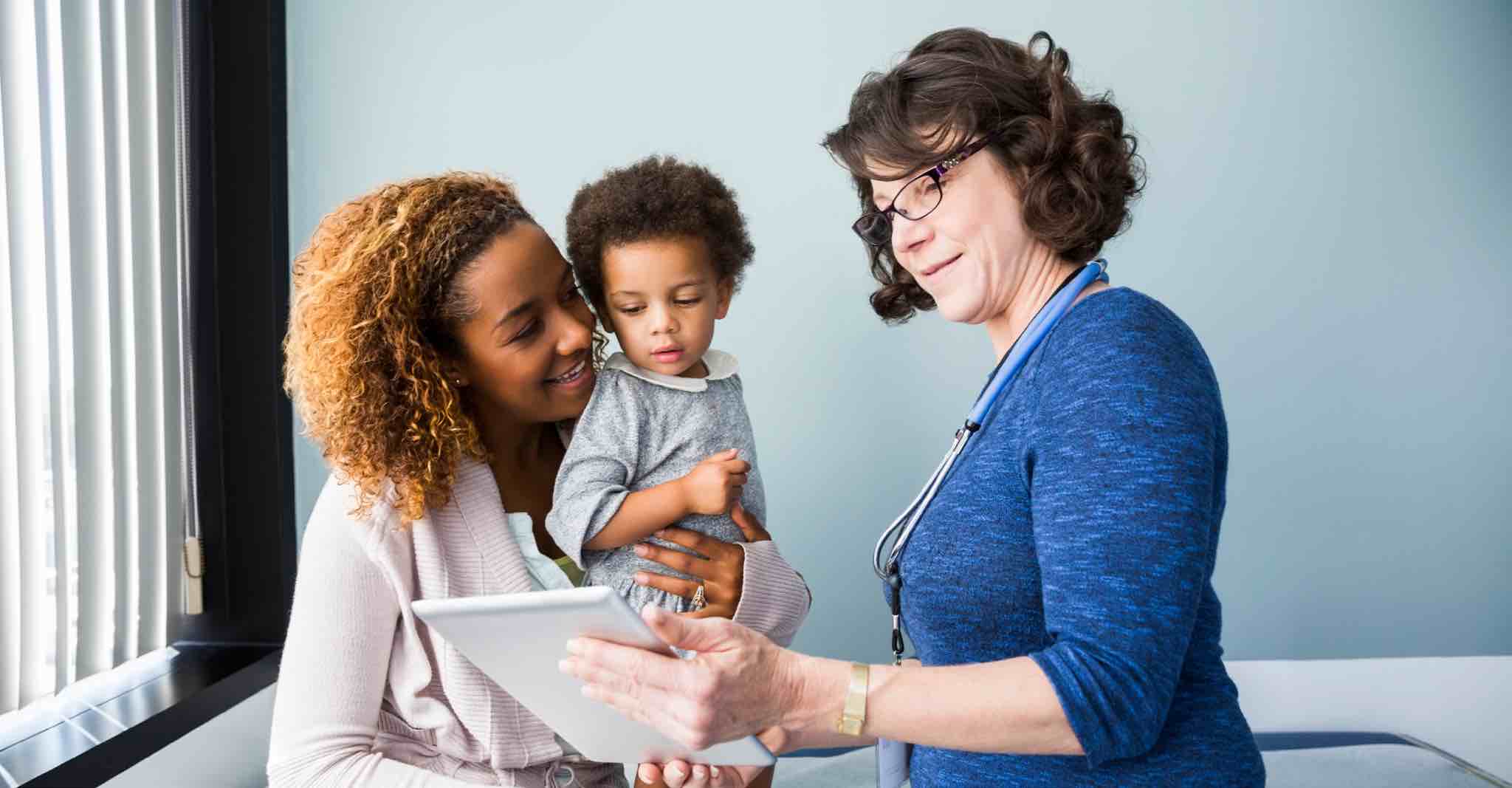 Parent and child meeting with doctor