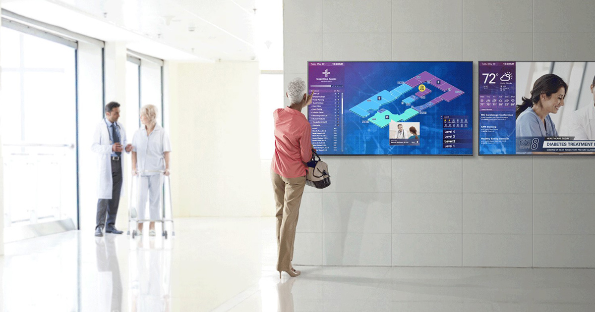 Patient looking a virtual monitor in hospital hallway