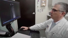 Health professional at desktop computer