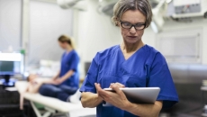 medical professional using a tablet