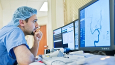 Healthcare worker looking at a display