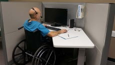Person in wheelchare at office desk