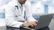 A doctor at a computer