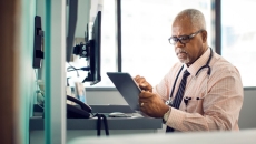 A doctor with a tablet