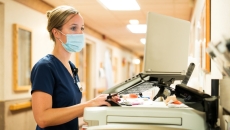 A nurse on a computer