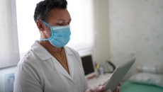 A nurse holding a tablet