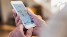 A user checking their health data on a mobile phone