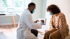Patient speaks with her doctor about treatment plan