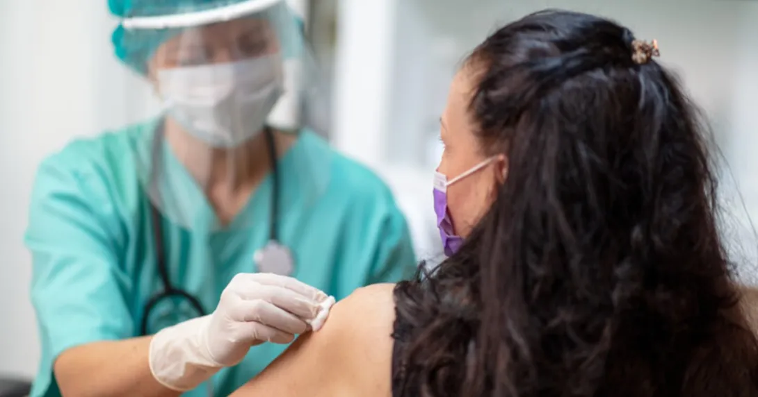 Nurse administers COVID-19 vaccine