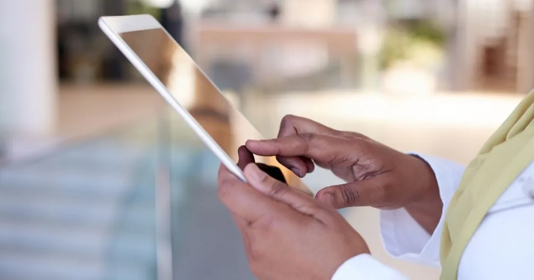 A doctor using a digital tablet
