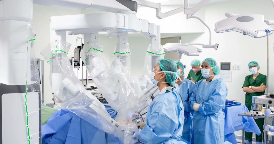 A surgeon operating a robotic-assisted surgery system A surgeon operating a robotic-assisted surgery system