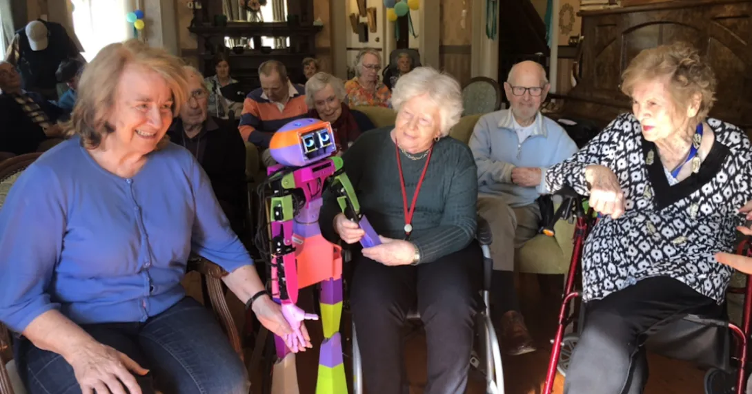 People interacting with a robotic companion