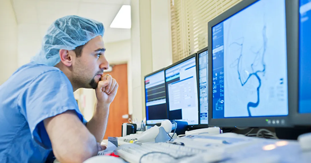 Healthcare worker looking at a display