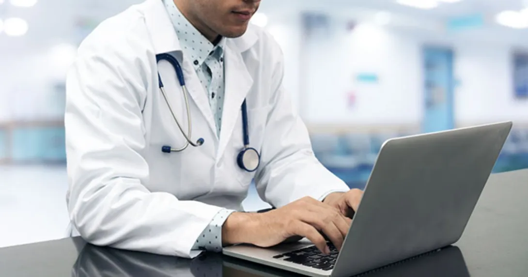 A doctor at a computer
