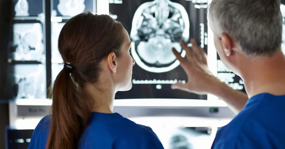 Healthcare workers looking at an X-ray